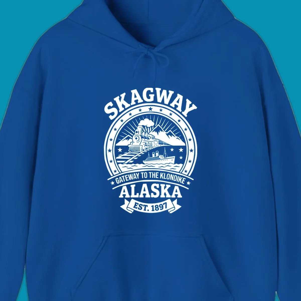 Vintage circular badge design featuring Skagway Klondike Gold Rush imagery with steam locomotive, mountains, steamship, and 1897 establishment date