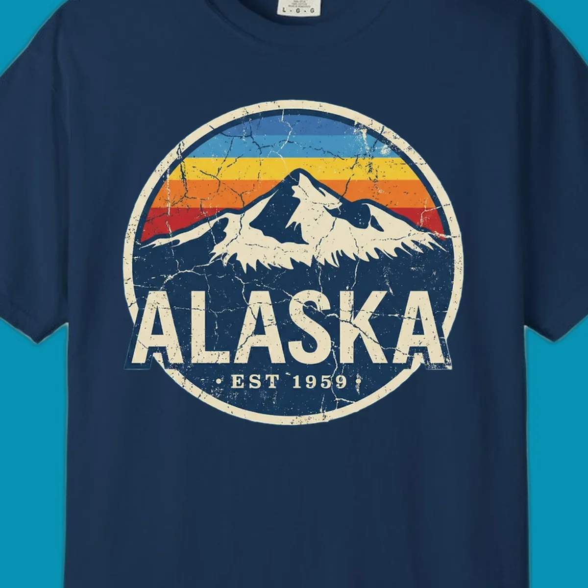Vintage circular badge with snow-capped Alaska mountain, retro rainbow stripes, and distressed cream border featuring 'ALASKA EST 1959' text