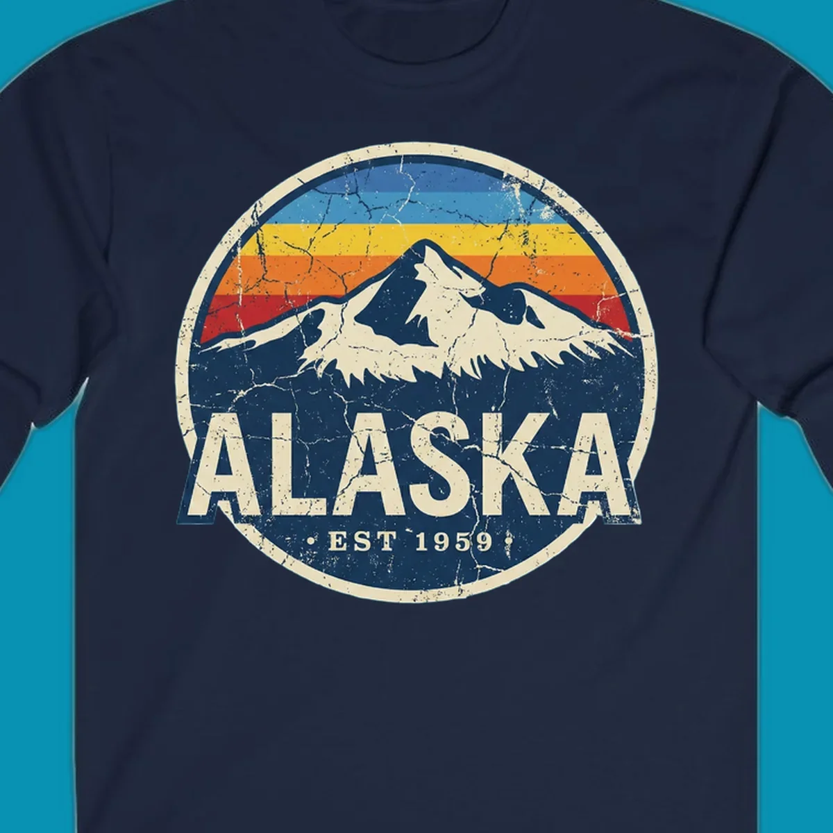 Vintage circular badge with snow-capped Alaska mountain, retro rainbow stripes, and distressed cream border featuring 'ALASKA EST 1959' text