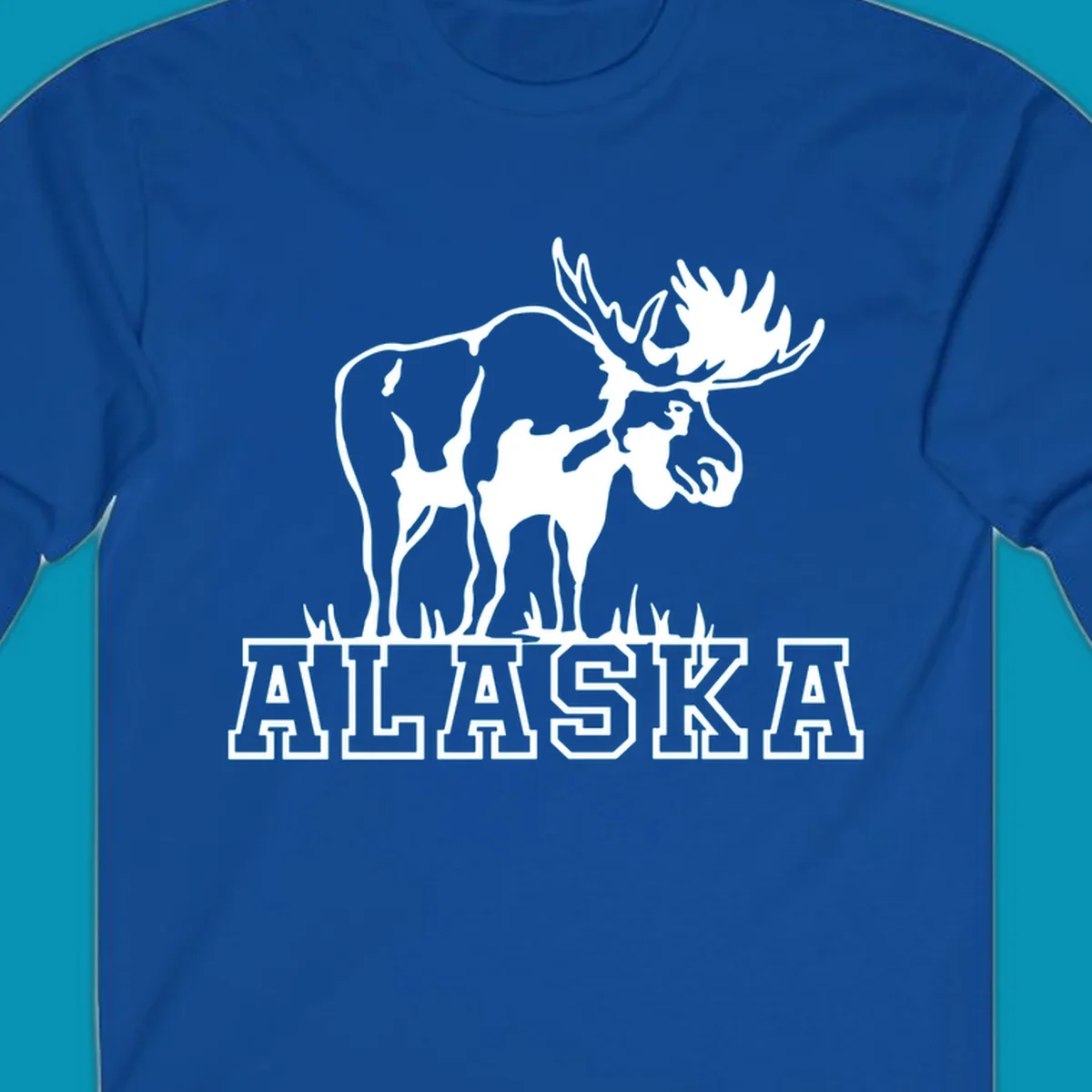White silhouette of a majestic moose with large antlers standing with grass below and ALASKA text, moose-alaska-silhouette design