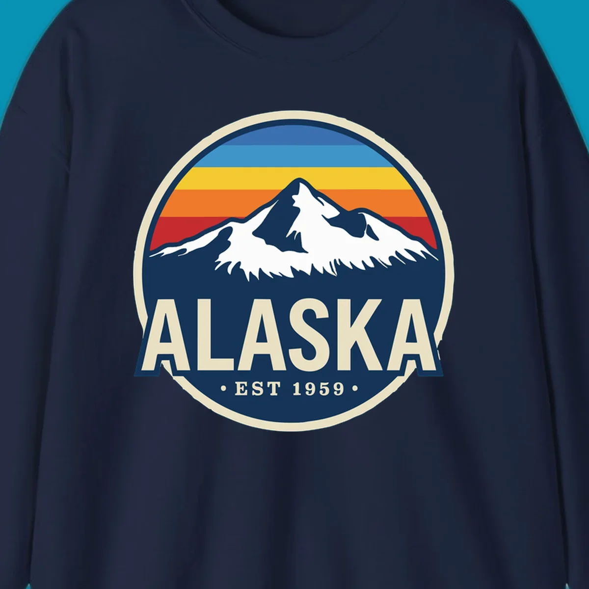 A circular alaska-mountain-range-sunset-badge design with retro stripes and white peaks above bold Alaska text.