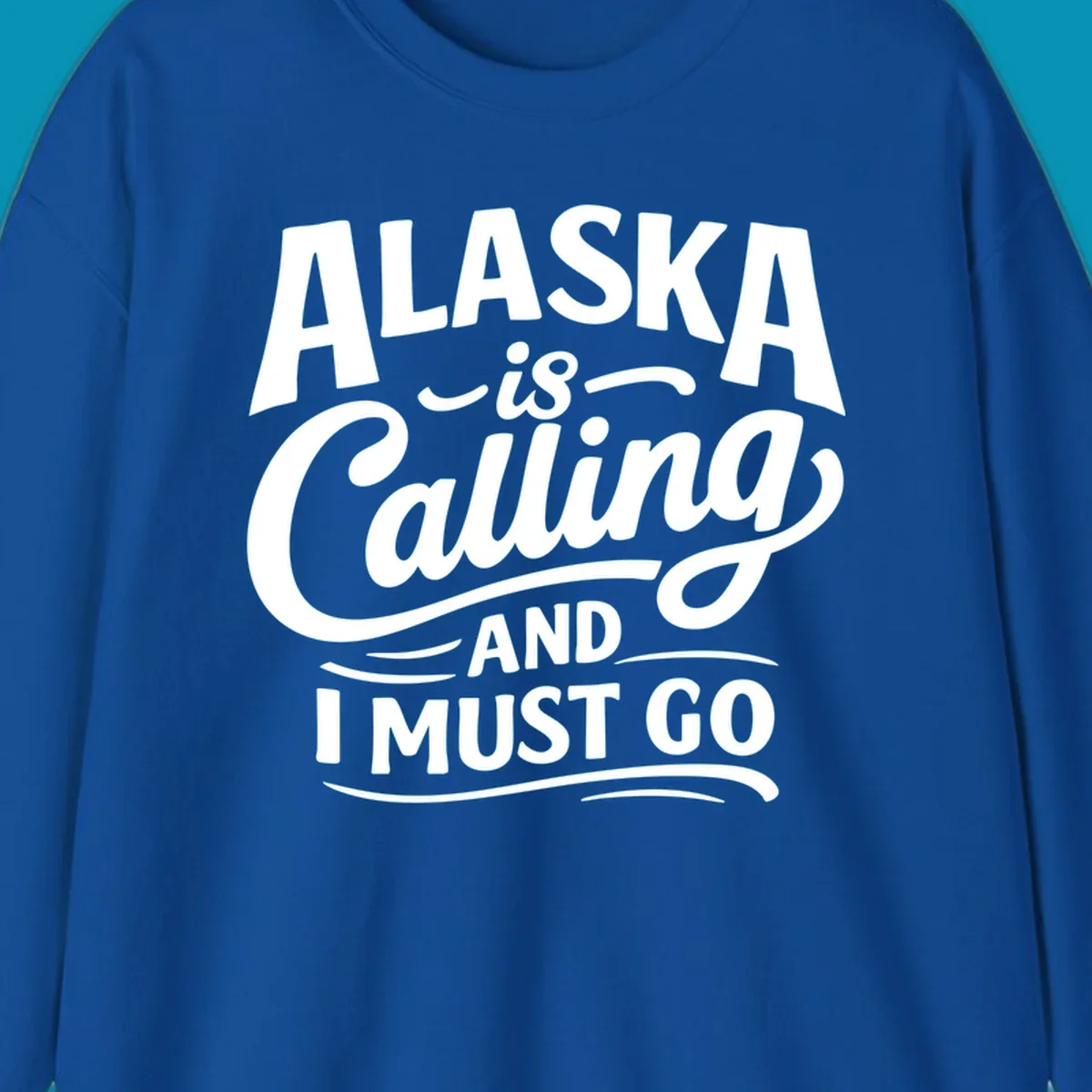 A white typography design on a black background reading Alaska is Calling and I Must Go in mixed fonts.