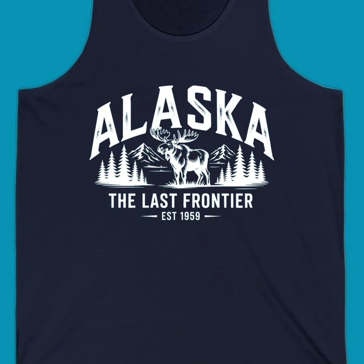 A white alaska-moose-frontier-scenic graphic showing a moose standing in front of mountains and pine trees.