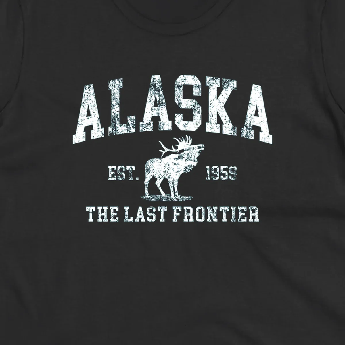 Distressed white design featuring a moose and the text ALASKA THE LAST FRONTIER.