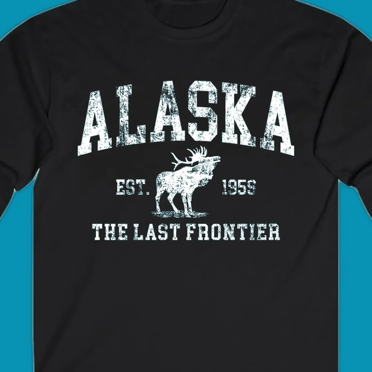 Distressed white design featuring a moose and the text ALASKA THE LAST FRONTIER.