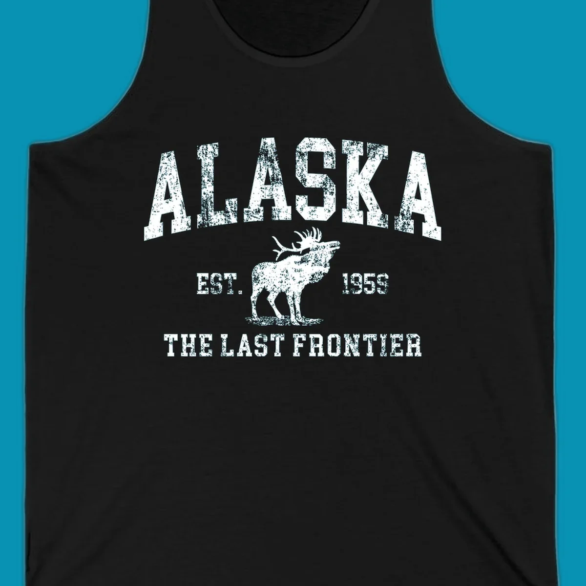 Distressed white design featuring a moose and the text ALASKA THE LAST FRONTIER.