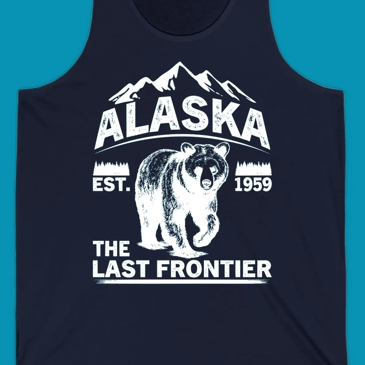White graphic of a walking grizzly bear under mountain peaks with alaska-grizzly-frontier-mountains text.