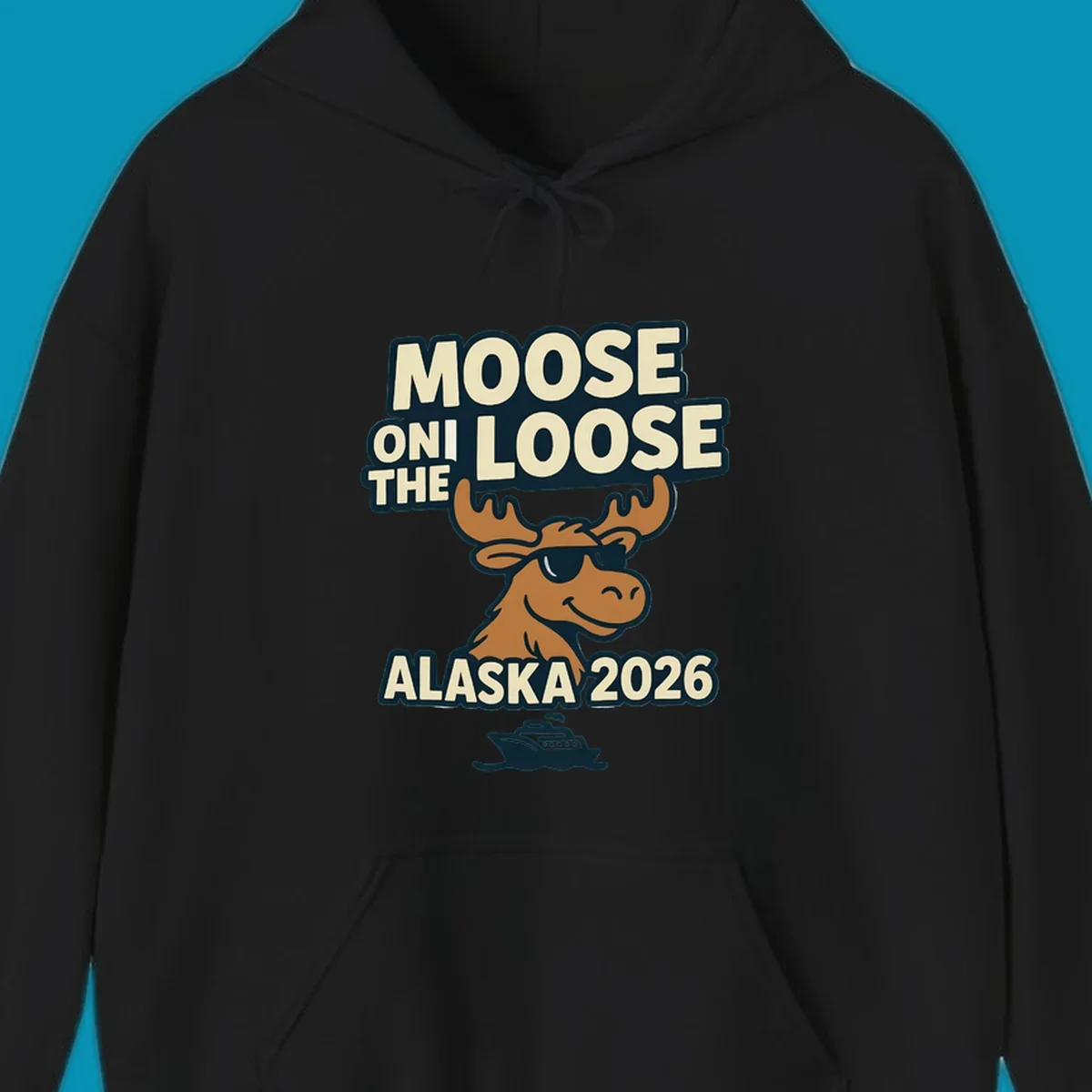 A smiling cartoon moose wearing sunglasses with antlers. Text reads 'MOOSE ON THE LOOSE ALASKA 2026', above a cruise ship, for a moose-on-the-loose-alaska cruise.