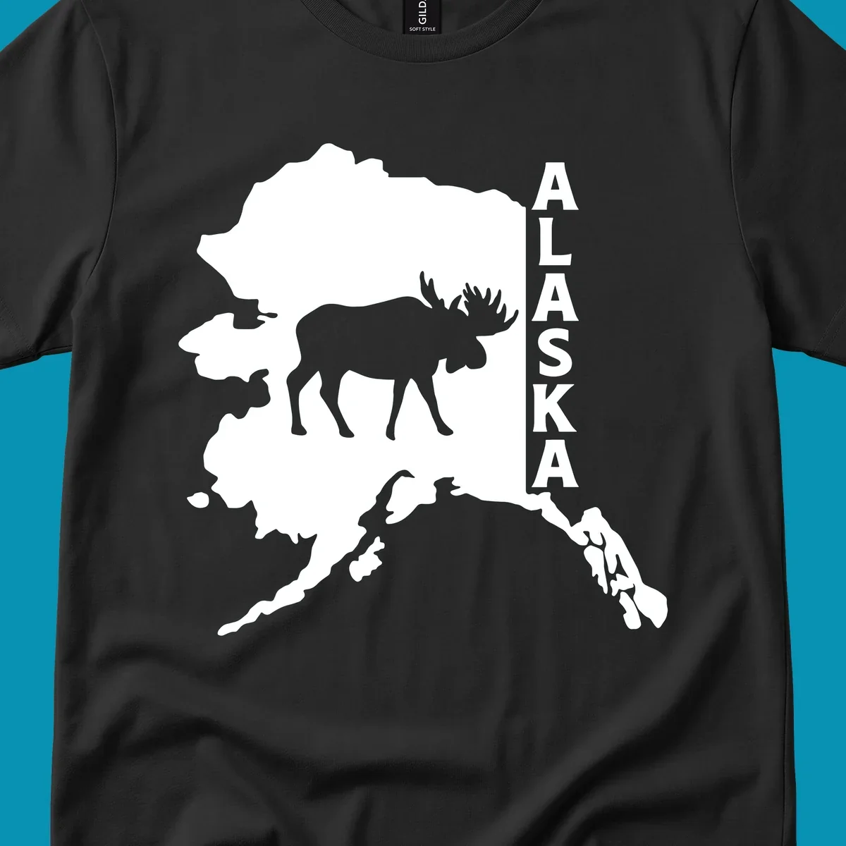 Bold white Alaska state map silhouette featuring a black moose and vertical ALASKA text.