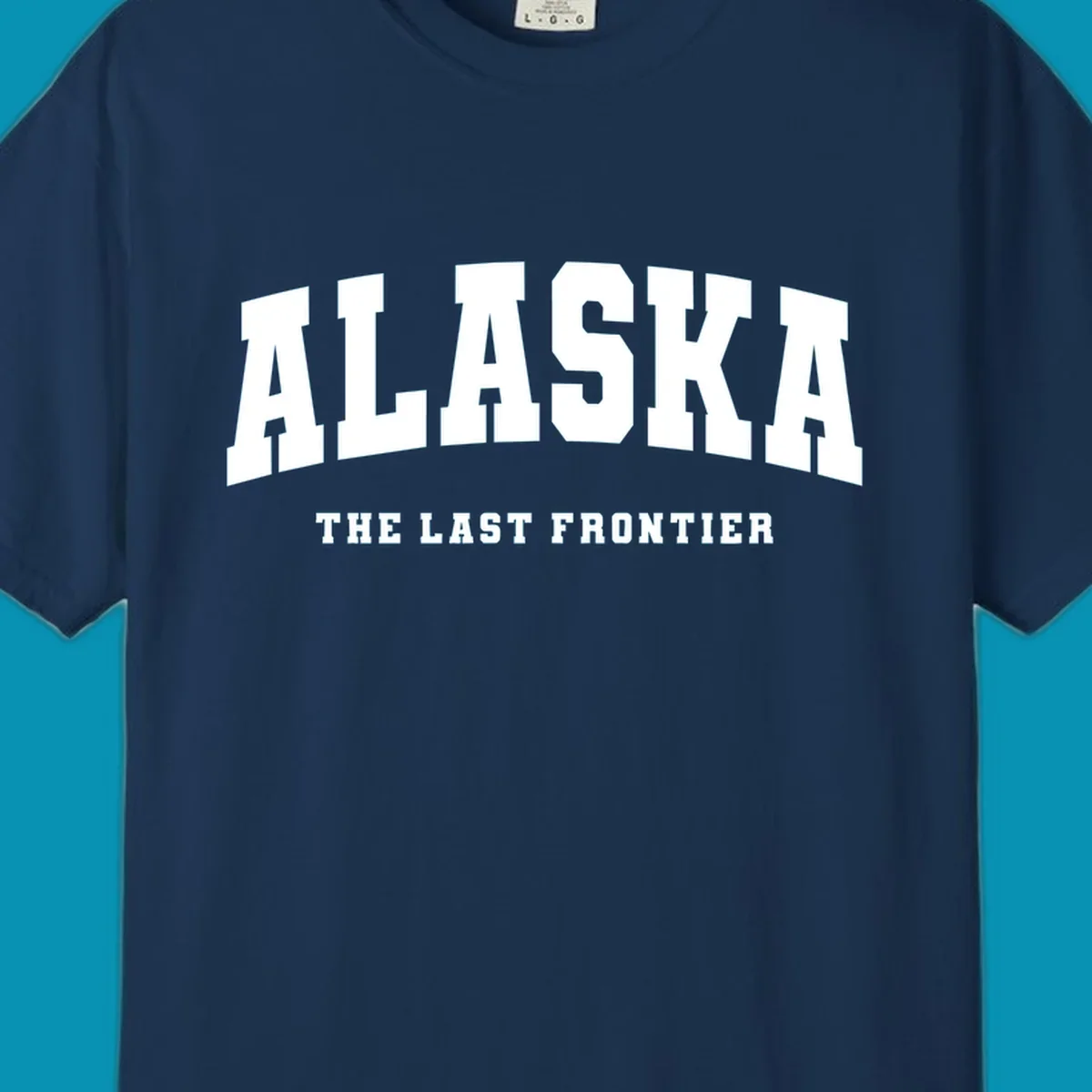 White block lettering on a black background reads 'ALASKA THE LAST FRONTIER', with 'ALASKA' larger. Design concept: alaska-last-frontier-typography.