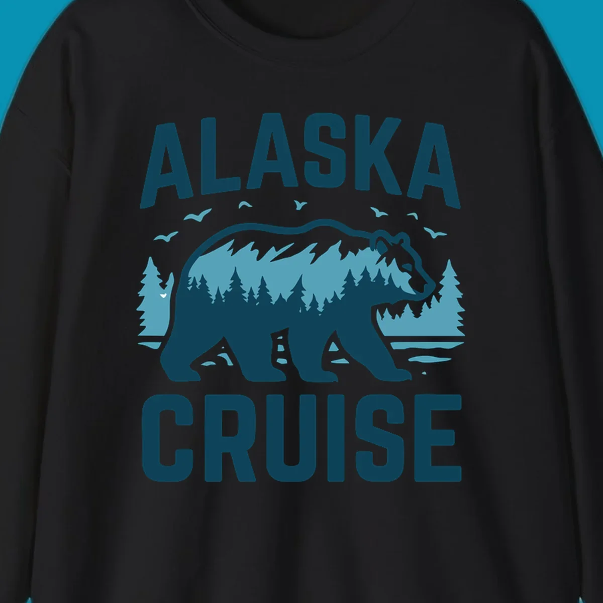 An illustrated design with 'ALASKA' and 'CRUISE' text, featuring a walking alaska-bear-mountain-silhouette filled with a forest and mountain landscape, surrounded by trees, birds, and water.