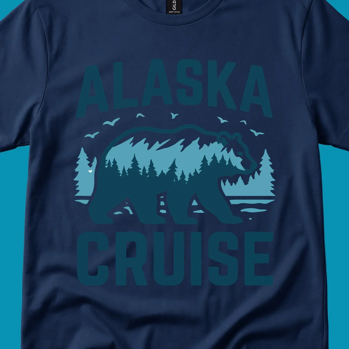 An illustrated design with 'ALASKA' and 'CRUISE' text, featuring a walking alaska-bear-mountain-silhouette filled with a forest and mountain landscape, surrounded by trees, birds, and water.