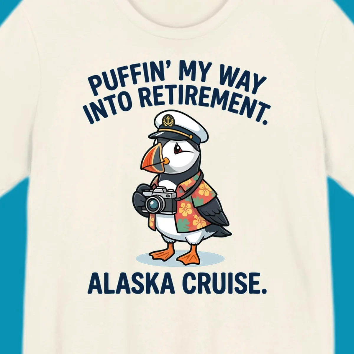 A cartoon puffin wearing a captain's hat and Hawaiian shirt holds a camera, with text 'PUFFIN' INTO MY RETIREMENT. ALASKA CRUISE.' for a puffin-into-retirement-cruise.
