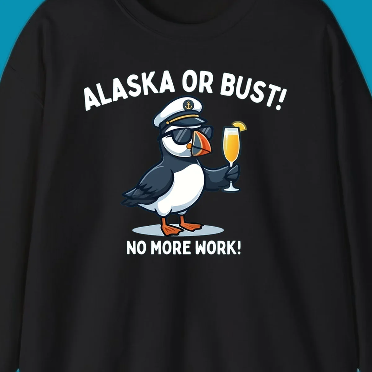 An illustrated puffin captain in sunglasses and a hat holds a cocktail with a lemon slice, with 'ALASKA OR BUST!' and 'NO MORE WORK!' text, representing the alaska-or-bust-captain-puffin concept.