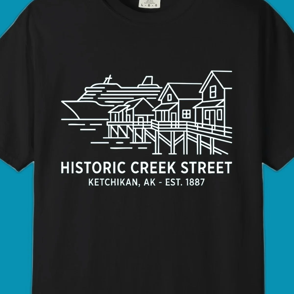 White line art illustration of Historic Creek Street in Ketchikan, Alaska, with a cruise ship, waterfront buildings, and text.