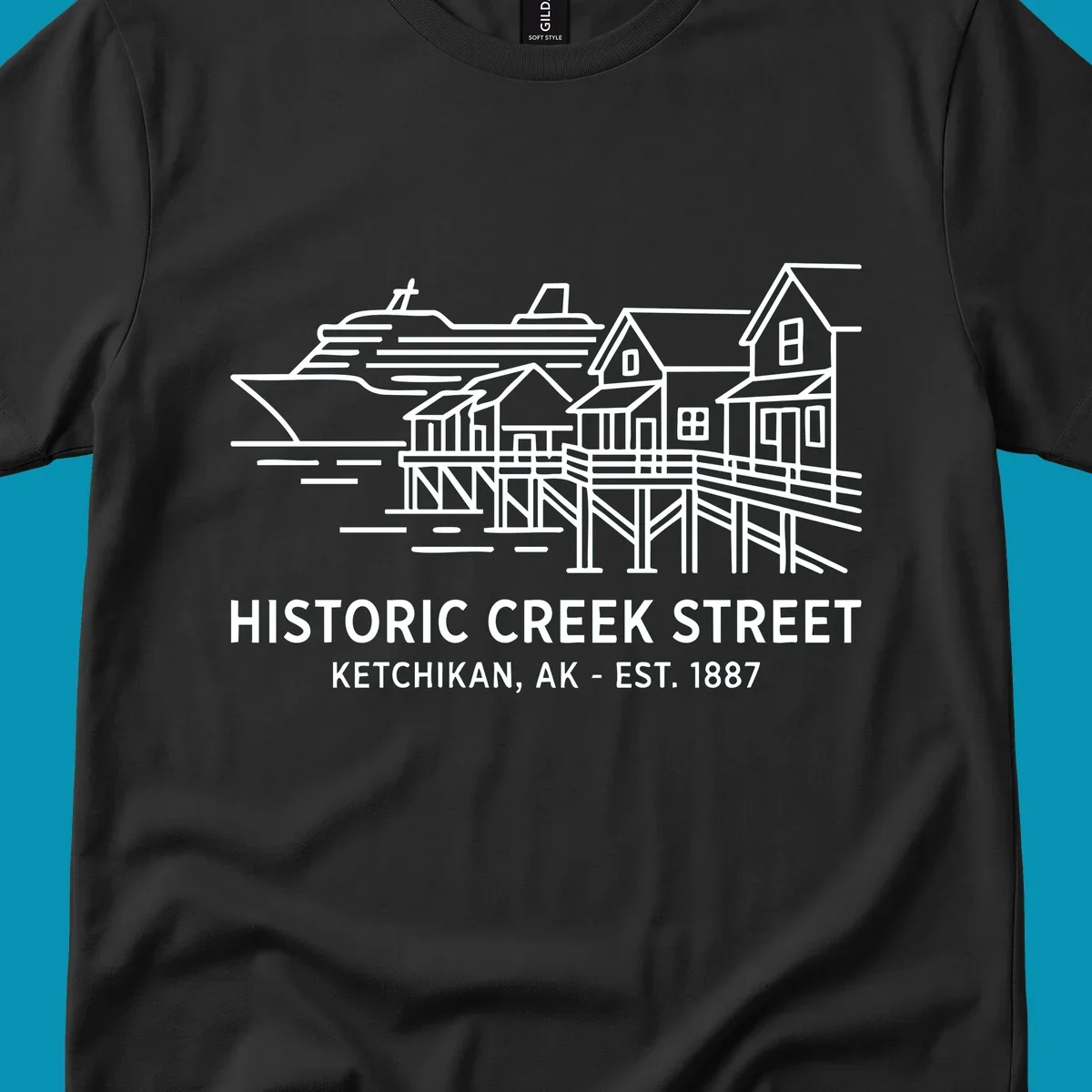 White line art illustration of Historic Creek Street in Ketchikan, Alaska, with a cruise ship, waterfront buildings, and text.