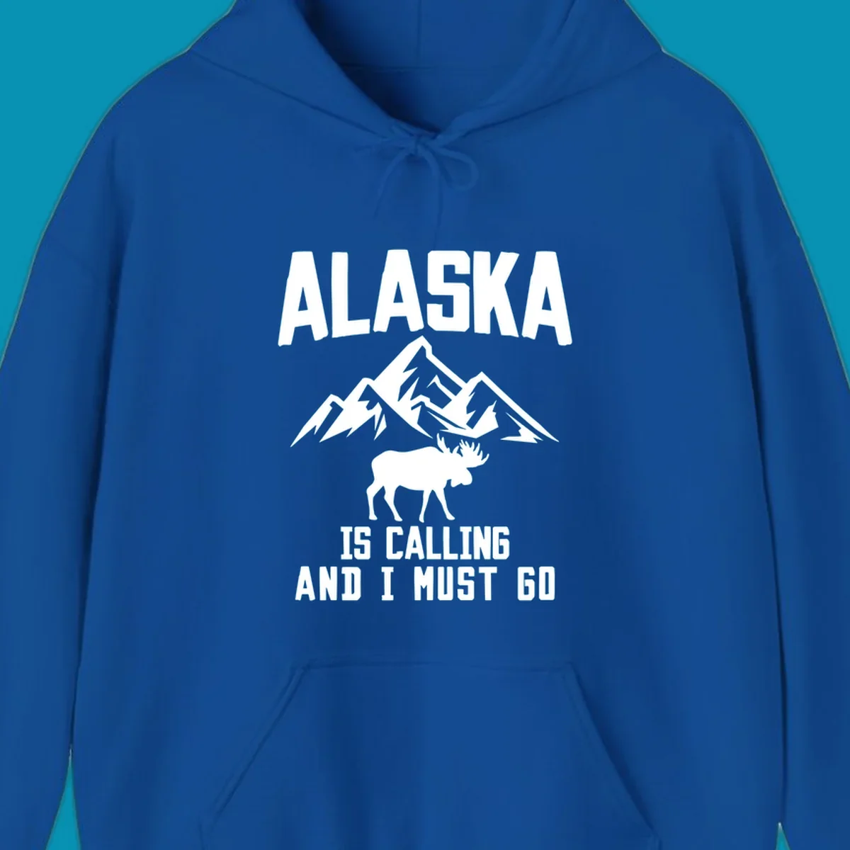 White moose silhouette and snow-capped mountains with text reading Alaska is calling and I must go