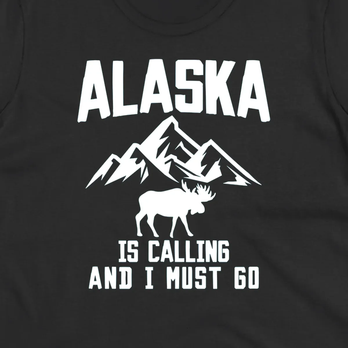 White moose silhouette and snow-capped mountains with text reading Alaska is calling and I must go