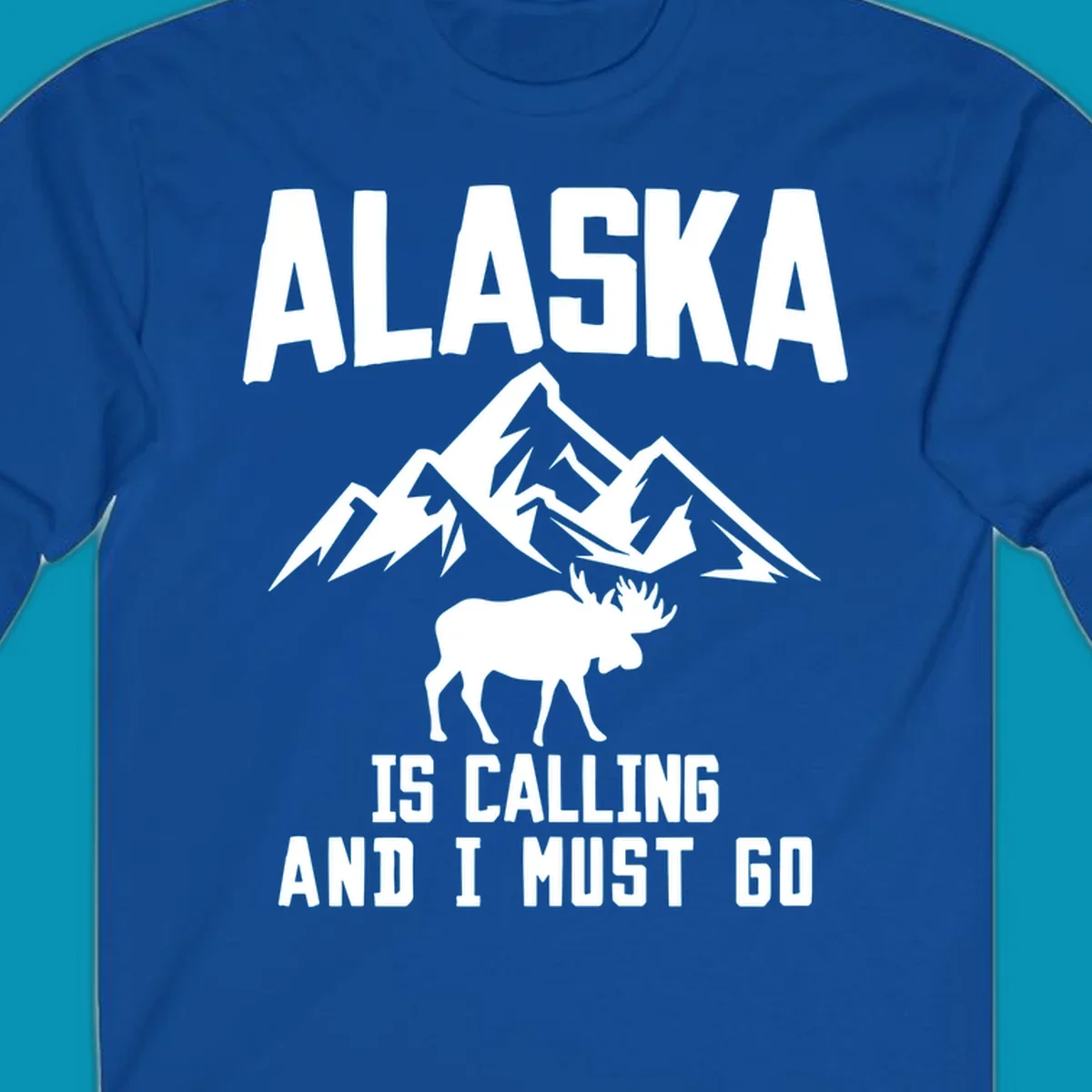 White moose silhouette and snow-capped mountains with text reading Alaska is calling and I must go