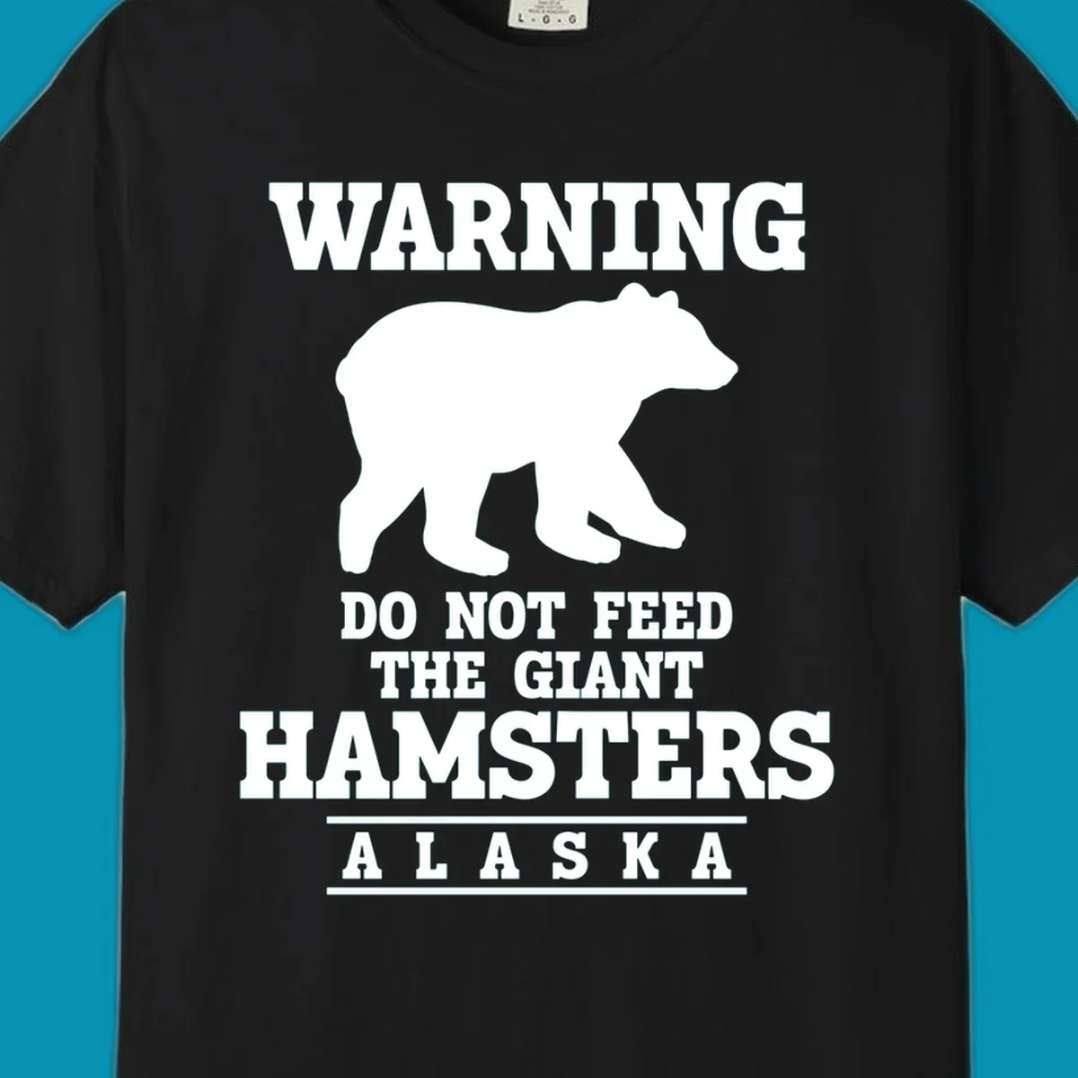 White bear silhouette with bold warning text reading 'Do Not Feed The Giant Hamsters Alaska' on gray background