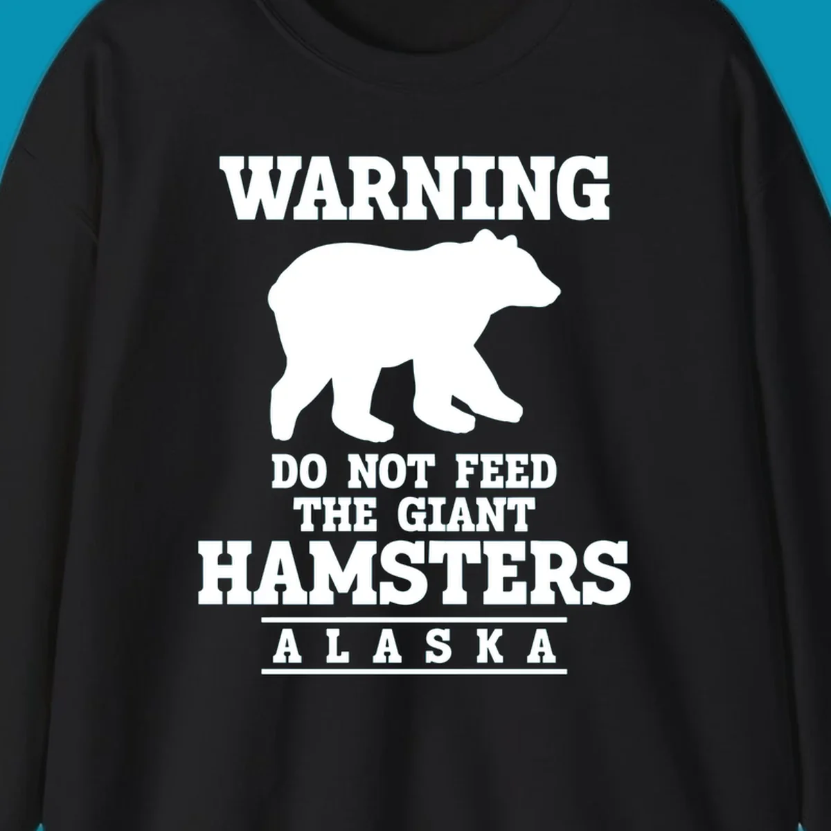 White bear silhouette with bold warning text reading 'Do Not Feed The Giant Hamsters Alaska' on gray background