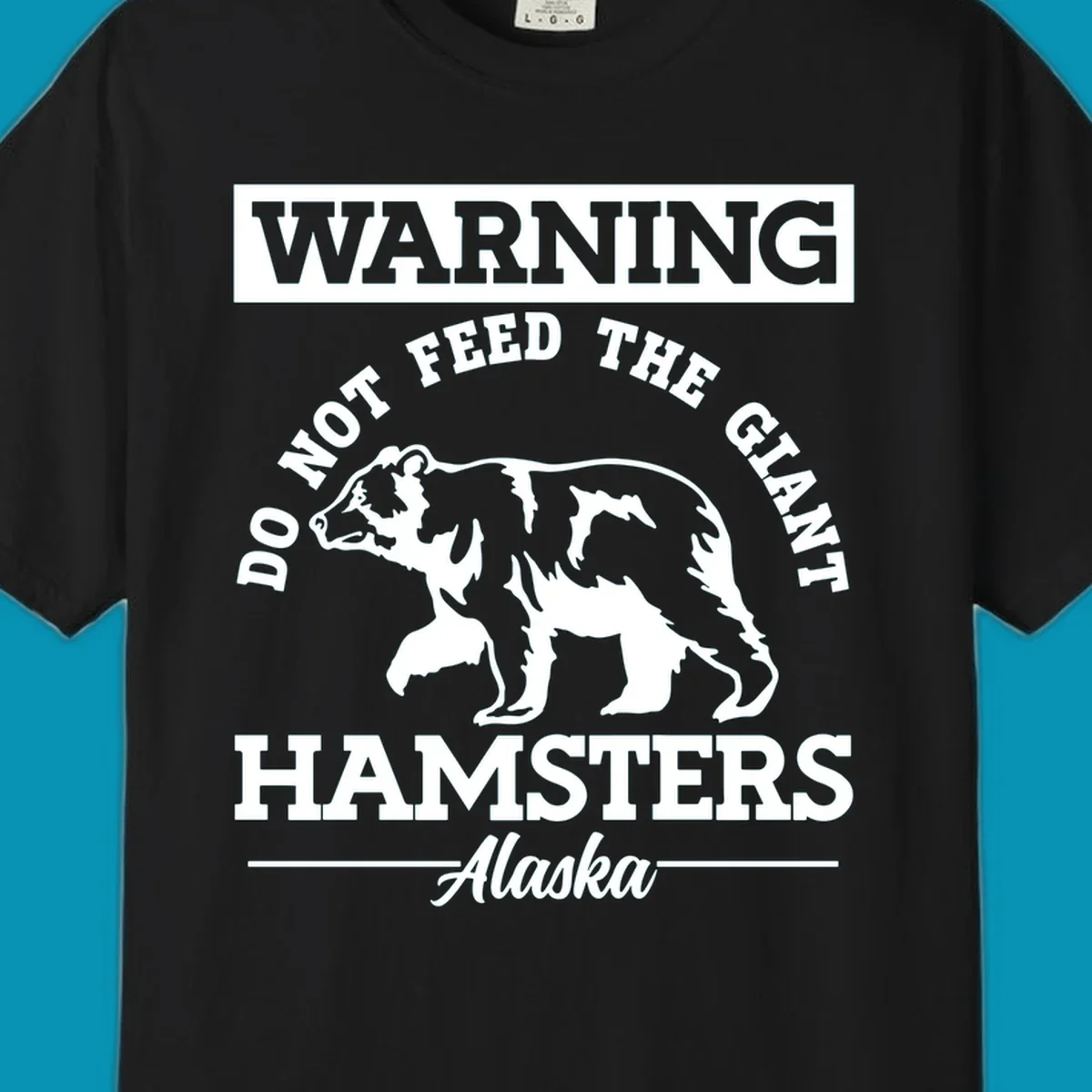 Gray and white warning sign design featuring a bear silhouette with text 'Do Not Feed The Giant Hamsters Alaska' for cruise apparel