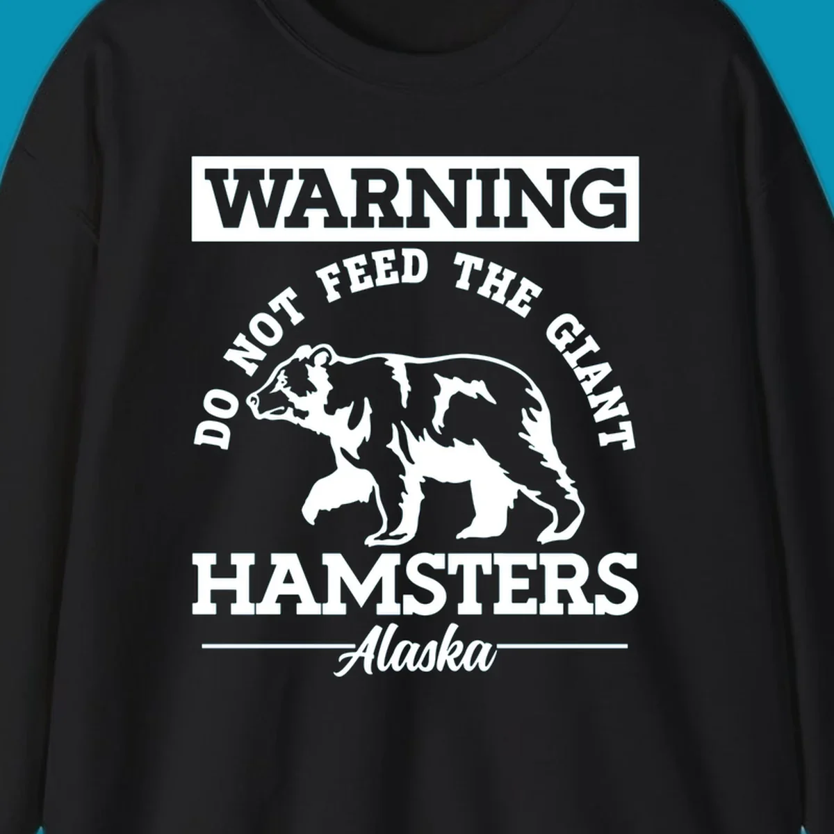 Gray and white warning sign design featuring a bear silhouette with text 'Do Not Feed The Giant Hamsters Alaska' for cruise apparel