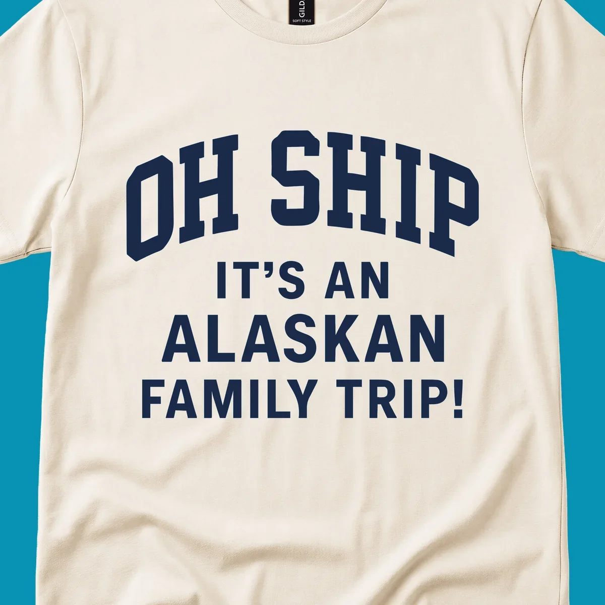 White and gray typography design with 'OH SHIP' pun and 'IT'S AN ALASKAN FAMILY TRIP!' text for cruise apparel