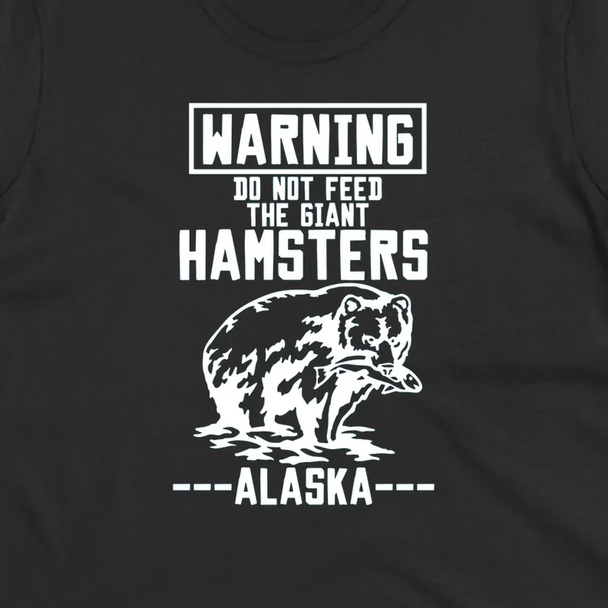 Warning-style design with giant hamster illustration and text reading 'Do Not Feed The Giant Hamsters Alaska' in white lettering on gray background