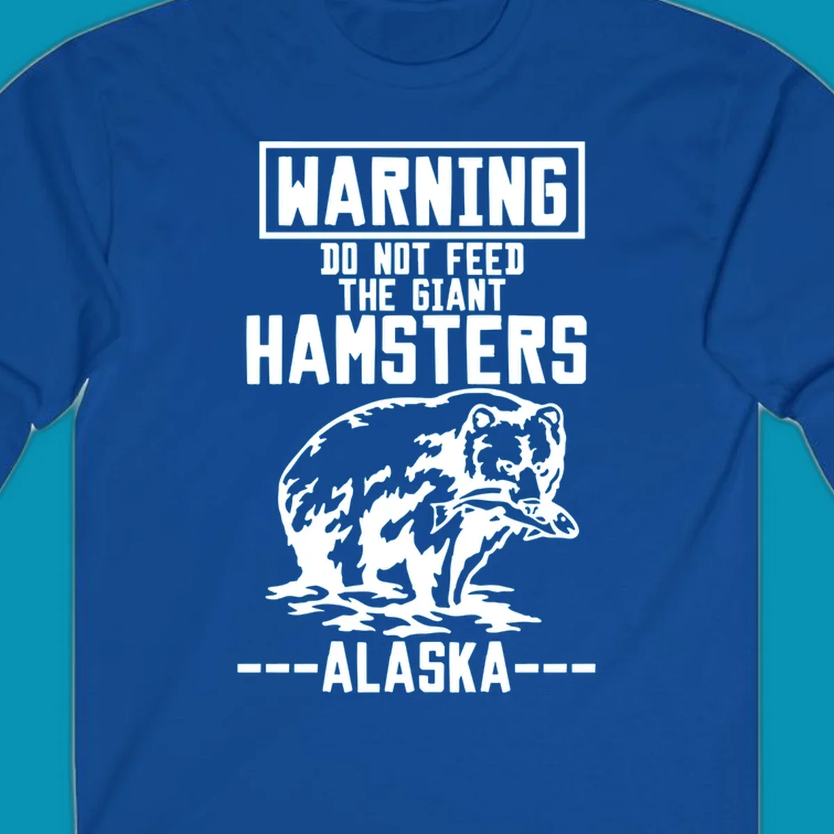 Warning-style design with giant hamster illustration and text reading 'Do Not Feed The Giant Hamsters Alaska' in white lettering on gray background