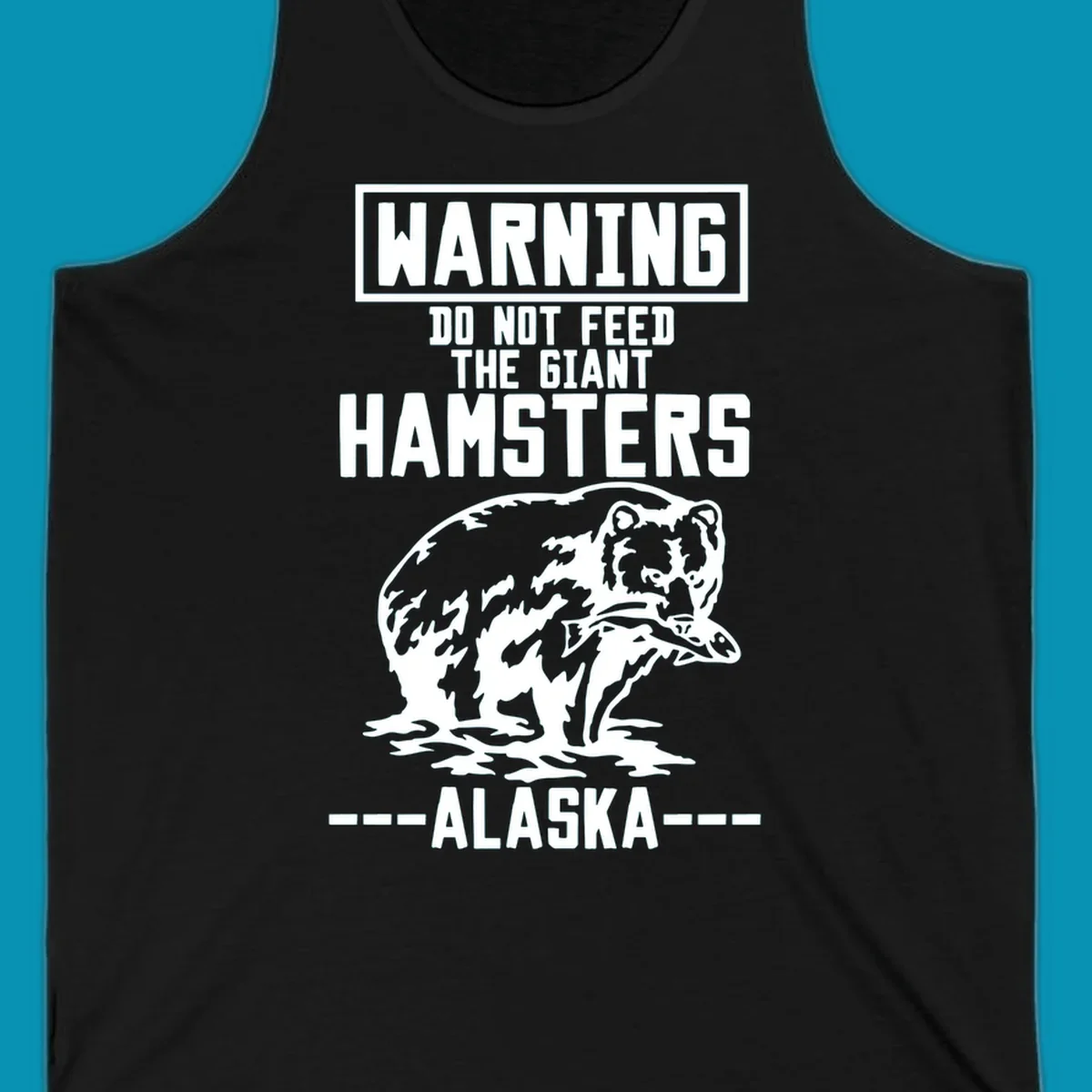 Warning-style design with giant hamster illustration and text reading 'Do Not Feed The Giant Hamsters Alaska' in white lettering on gray background