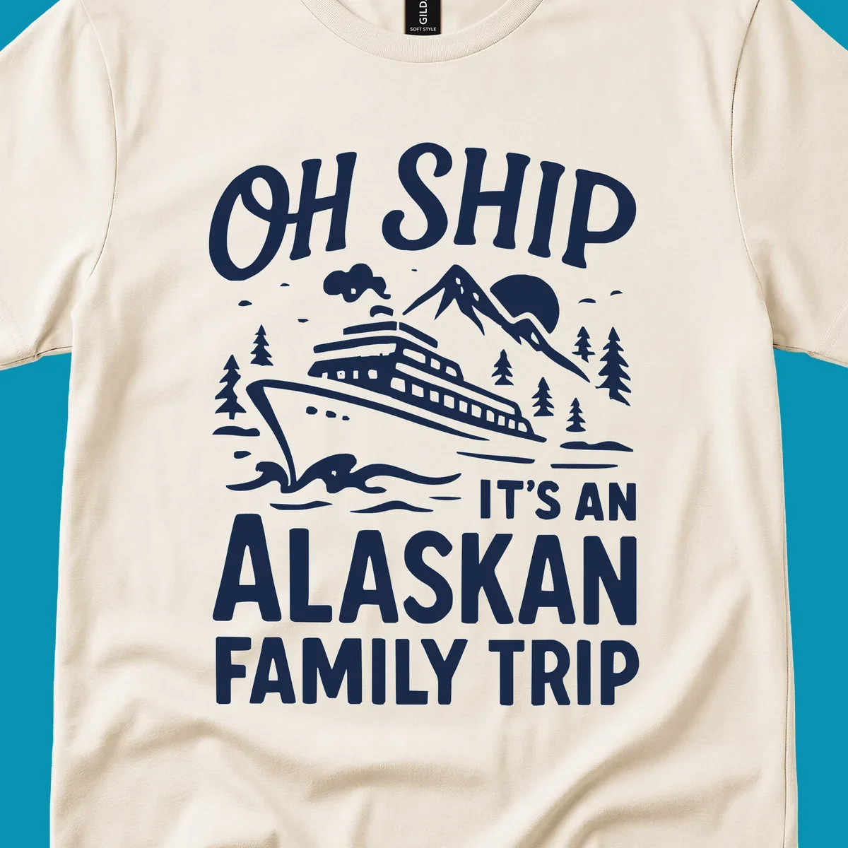 White illustration of a cruise ship with mountains and trees showing 'Oh Ship It's An Alaskan Family Trip' text design