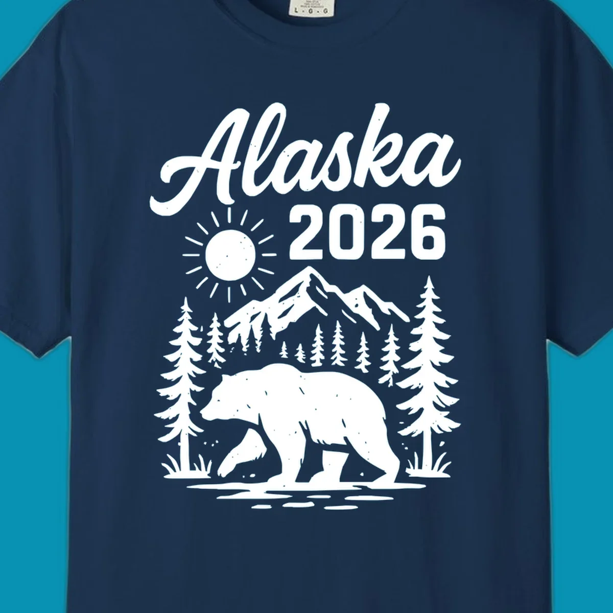 Alaska 2026 design featuring a polar bear walking through snowy mountains surrounded by evergreen trees and bright sun