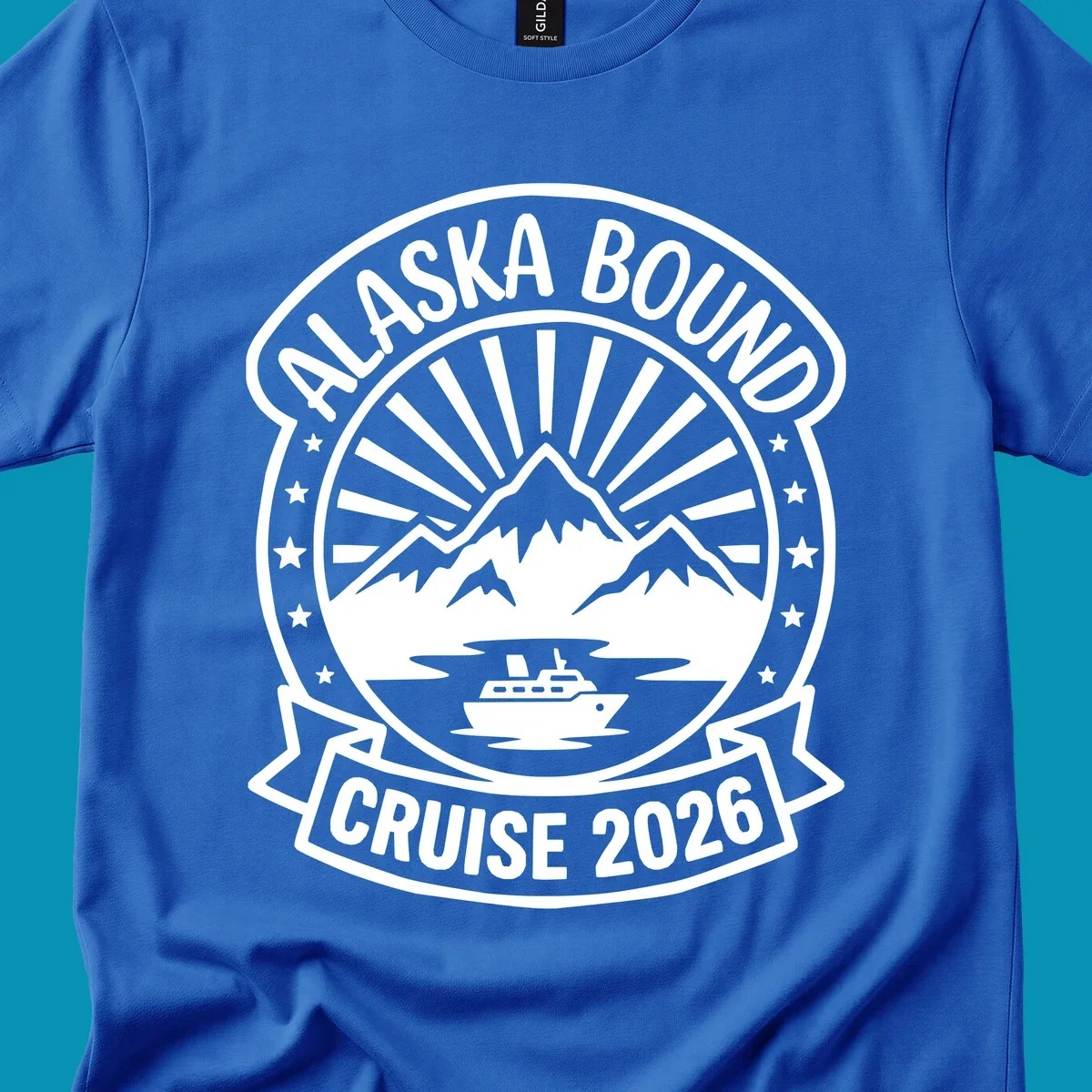 Vintage circular badge with 'Alaska Bound Cruise 2026' text, featuring snow-capped mountains, cruise ship, and radiating sun rays