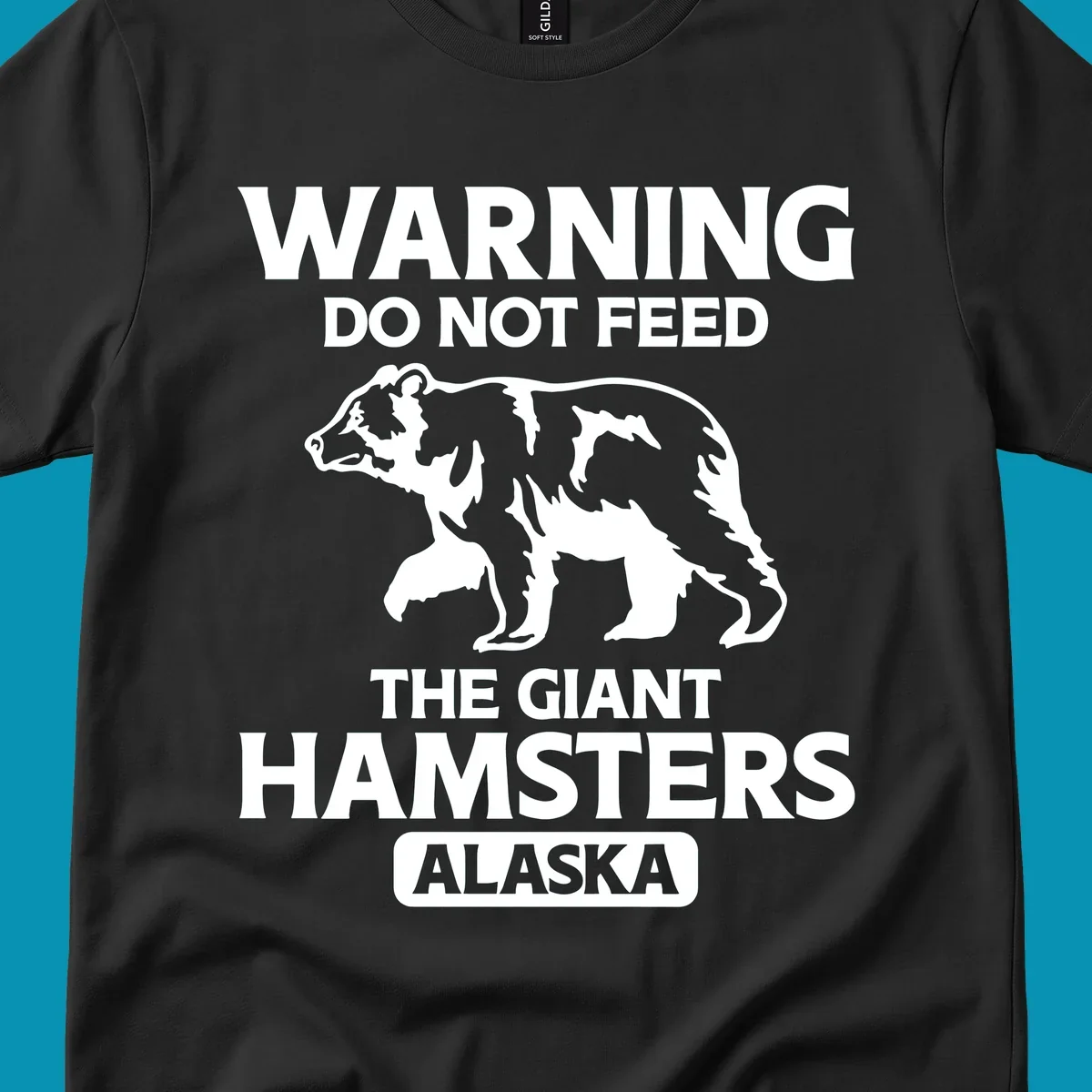White bear silhouette with bold warning text 'Do Not Feed The Giant Hamsters Alaska' on gray background