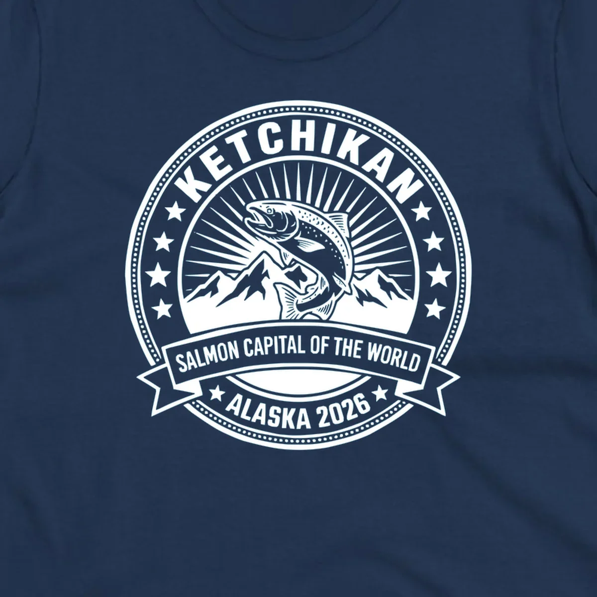 Ketchikan salmon capital badge with leaping salmon, mountain peaks, stars, and circular frame design