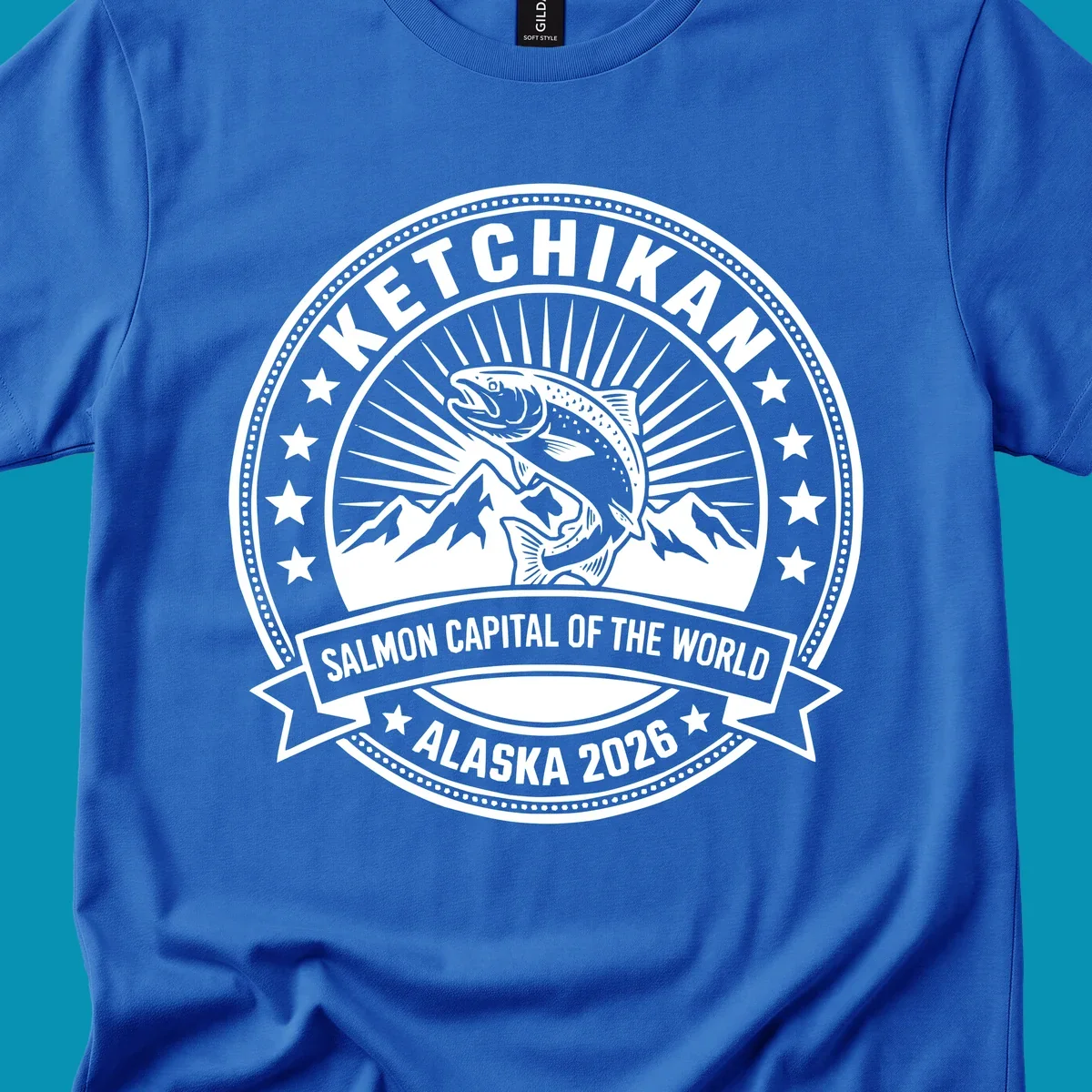Ketchikan salmon capital badge with leaping salmon, mountain peaks, stars, and circular frame design