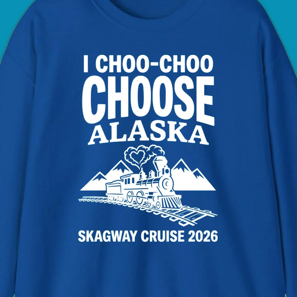 Choo-choo-choose-skagway design: vintage steam locomotive on tracks with mountains and heart-shaped steam cloud, text reads I Choo-Choo Choose Alaska Skagway Cruise 2026