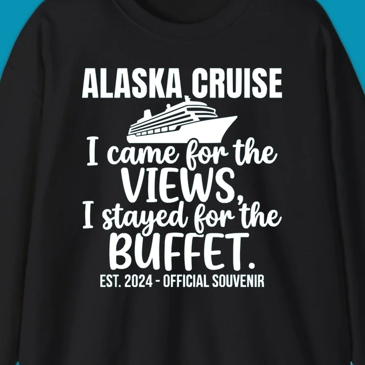 Gray t-shirt design with white cruise ship illustration and text reading 'I came for the views, I stayed for the buffet' — a funny Alaska cruise souvenir design