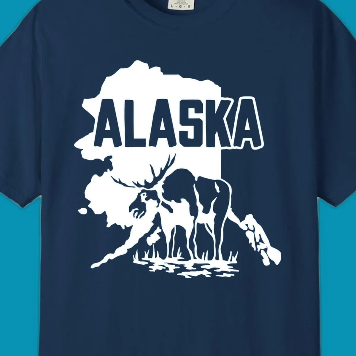 Alaska state map silhouette filled with moose, bear, and eagle wildlife illustrations with grass and water landscape elements