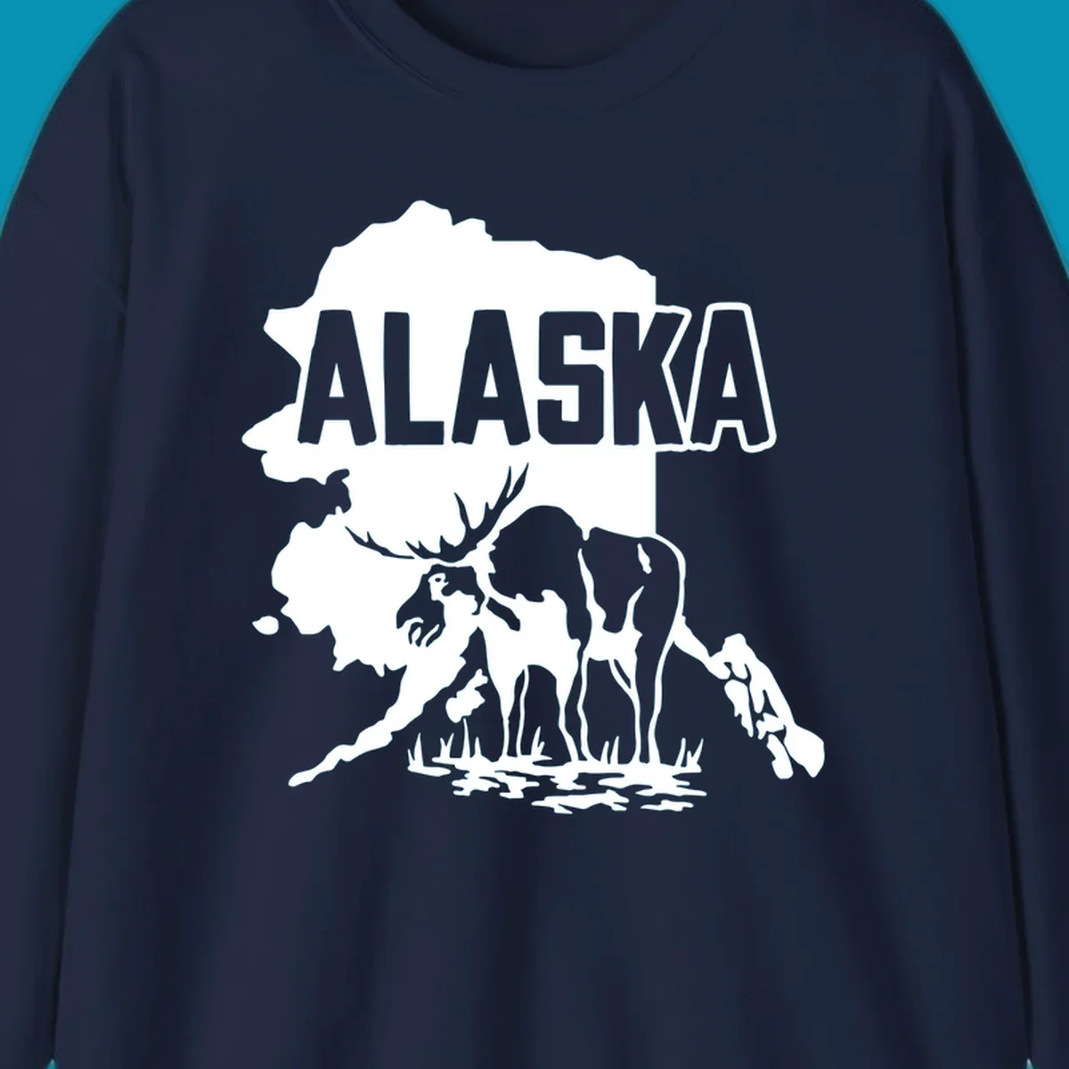 Alaska state map silhouette filled with moose, bear, and eagle wildlife illustrations with grass and water landscape elements