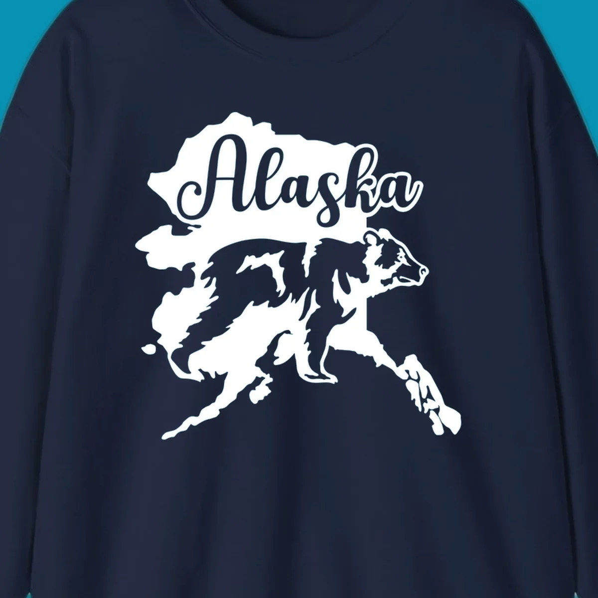 Alaska state map with bear silhouette and 'Alaska' text in elegant script lettering on gray background