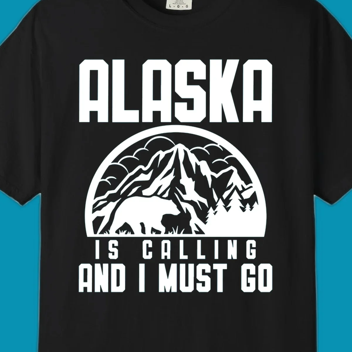 Vintage badge design with 'Alaska Is Calling And I Must Go' text, featuring mountain peak, bear, and evergreen trees