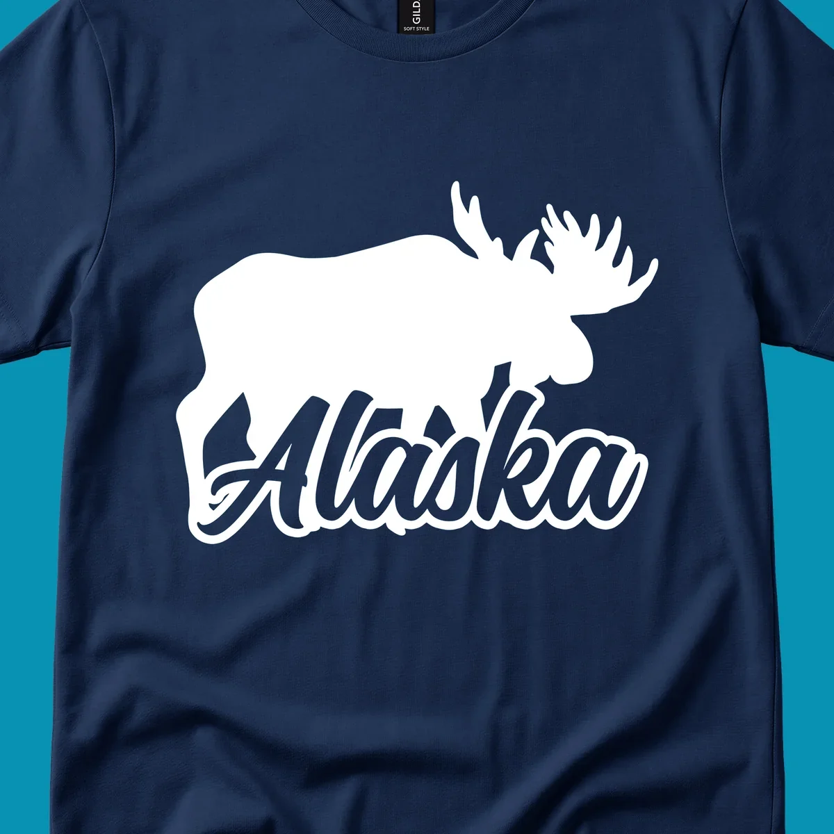 White moose silhouette with branching antlers above stylized 'Alaska' text in gray lettering on gray background