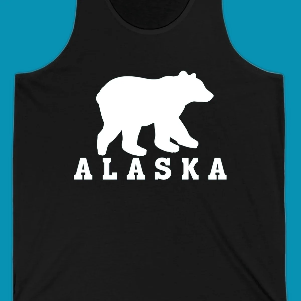 White bear silhouette standing with front paws visible, Alaska text below with pine tree accents on gray background