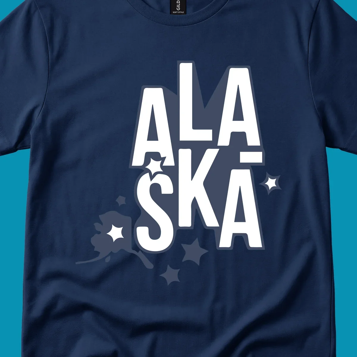 Alaska adventure lettering design with bold outlined text, decorative stars, and botanical accents in navy and white