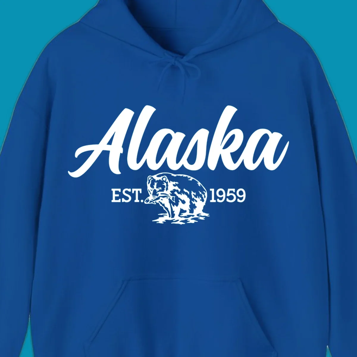 Vintage-style alaskan bear badge design with script lettering and established 1959 date on gray background