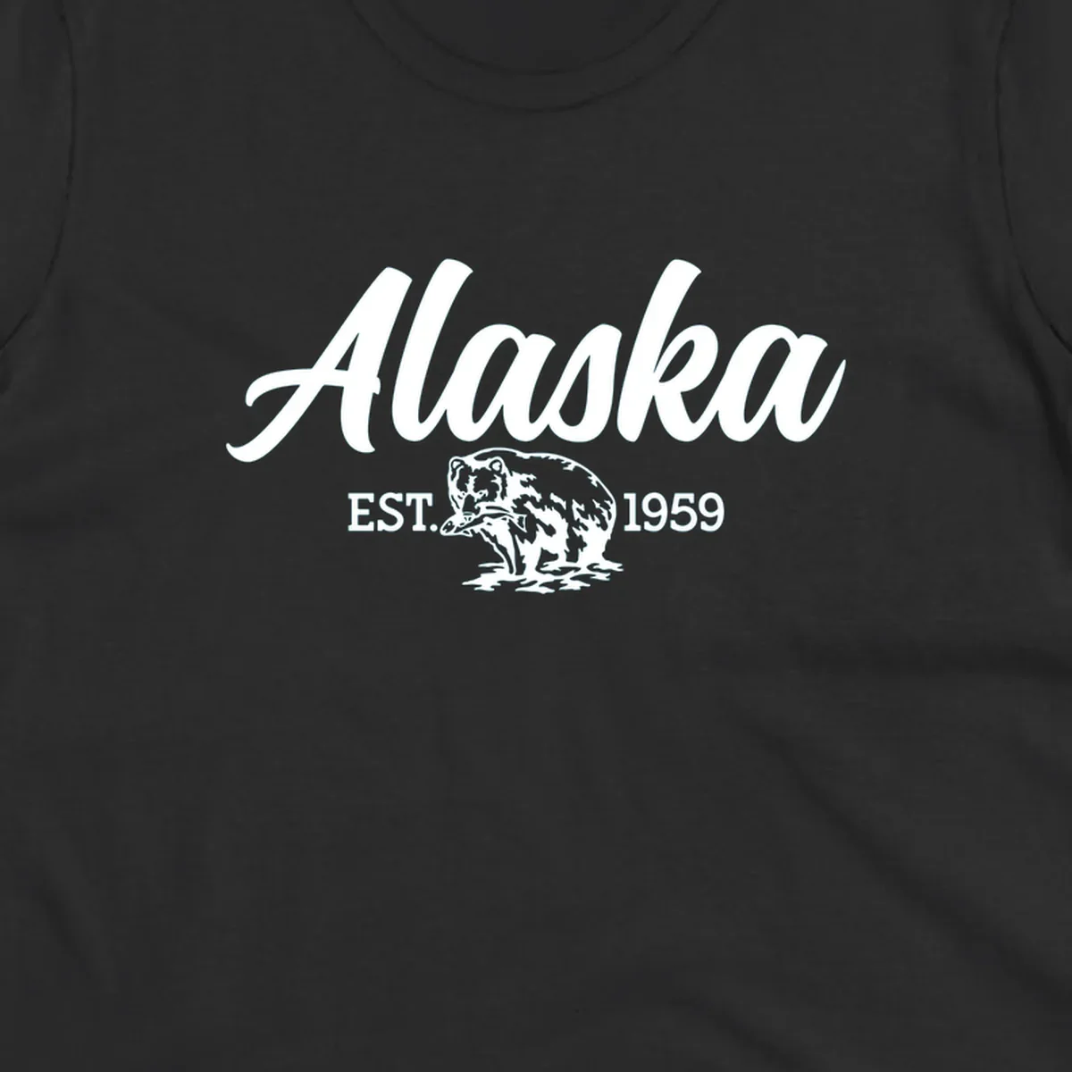 Vintage-style alaskan bear badge design with script lettering and established 1959 date on gray background