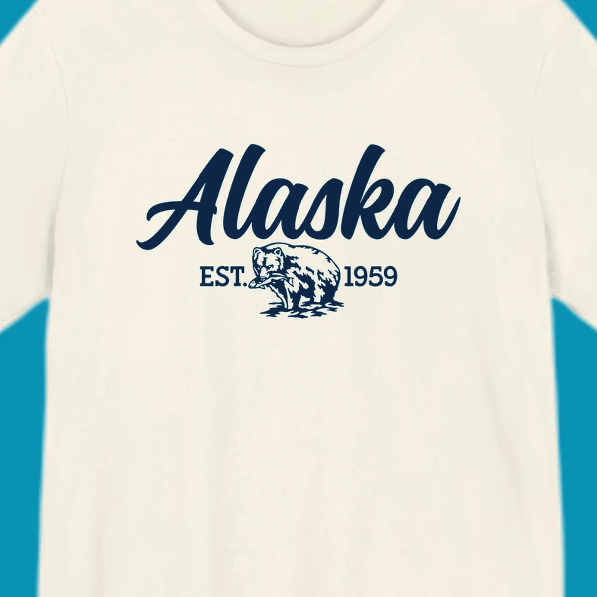 Vintage-style alaskan bear badge design with script lettering and established 1959 date on gray background