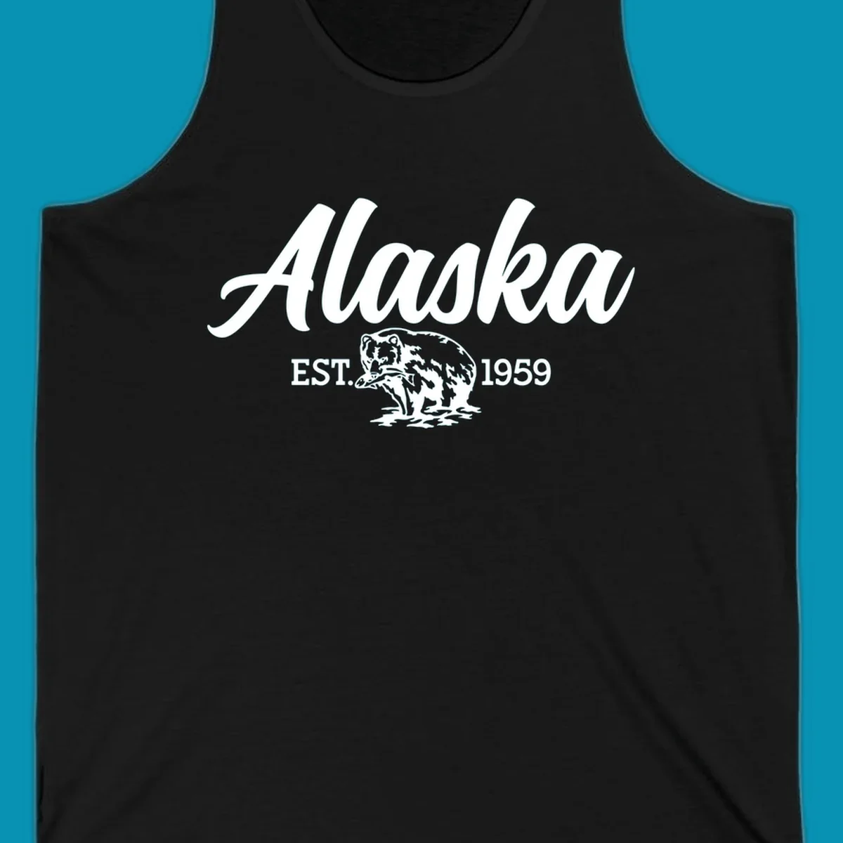 Vintage-style alaskan bear badge design with script lettering and established 1959 date on gray background